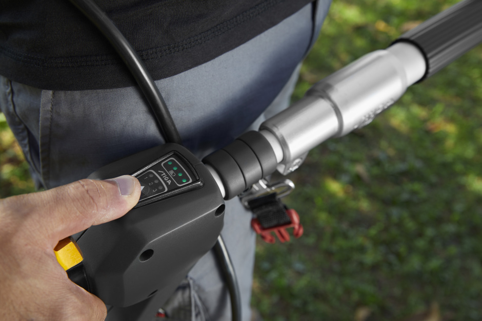 Stiga SPH 900 AE 48v Cordless Long-Reach Hedgetrimmer - In Use Showing Digital Keypad Control.