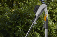 Stiga SPH 900 AE 48v Cordless Long-Reach Hedgetrimmer - In Use with Cutter Head Angled.