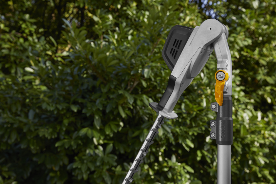 Stiga SPH 900 AE 48v Cordless Long-Reach Hedgetrimmer - In Use with Cutter Head Angled.