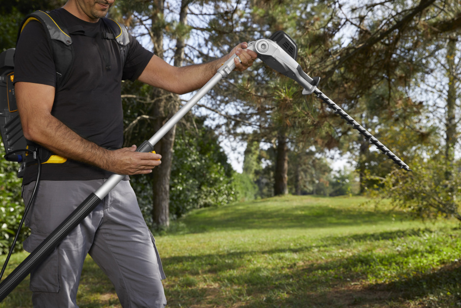 Stiga SPH 900 AE 48v Cordless Long-Reach Hedgetrimmer - In Use with Cutter Head at 90°.