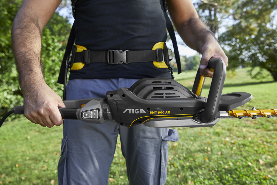 Stiga SHT 900 AE 48v Cordless Hedgetrimmer - In Use with Rear Handle at 90°.