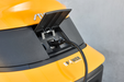 Stiga Gyro 700e ‘Drive-by-Wire’ Electric Battery-Powered Axial Ride-On Lawnmower - Charging Port with Cover Open and Power Lead Plugged-In.