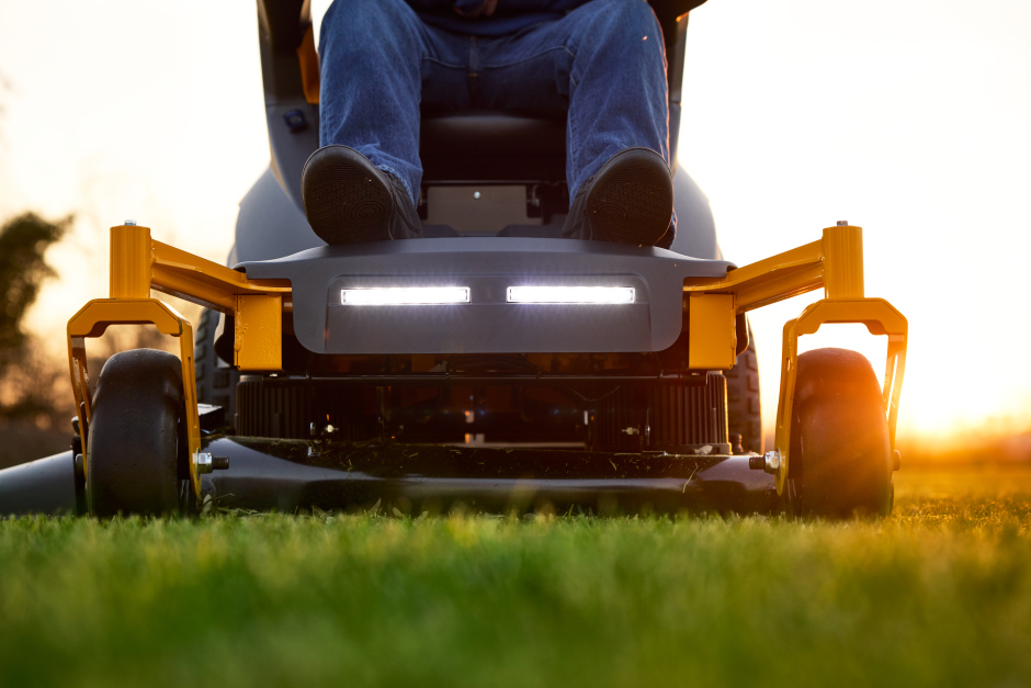 Stiga Gyro 700e ‘Drive-by-Wire’ Electric Battery-Powered Axial Ride-On Lawnmower - In Use - Front-End View with Headlights On.