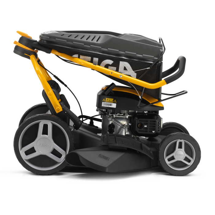 Stiga Combi 748 S - Fulcrum Handlebar Folded for Storage with Grass-Collector on Top of Machine.
